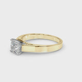Yellow gold Cushion Solitaire Engagement Ring with Four-Prong Setting and Tapered Band