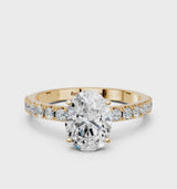 Yellow gold Oval Cut Diamond Solitaire Pavé Band with Four-Prong Setting