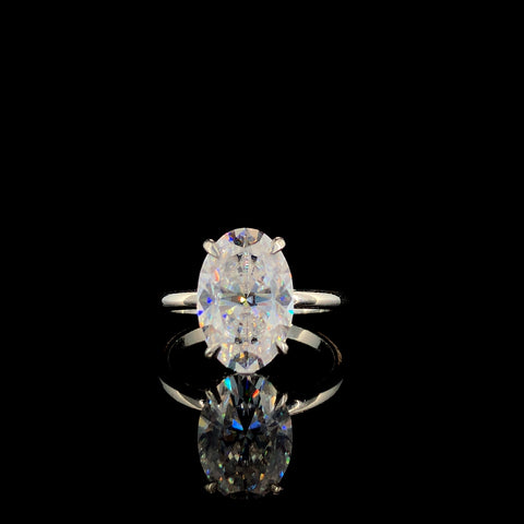 Rose gold Oval Solitaire Ring with Four-Prong Setting on a Classic Band